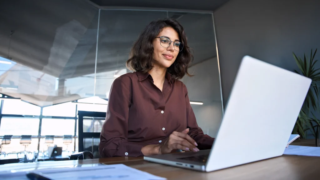 Professional working on a laptop, representing the use of Microsoft Dynamics GP in daily operations.